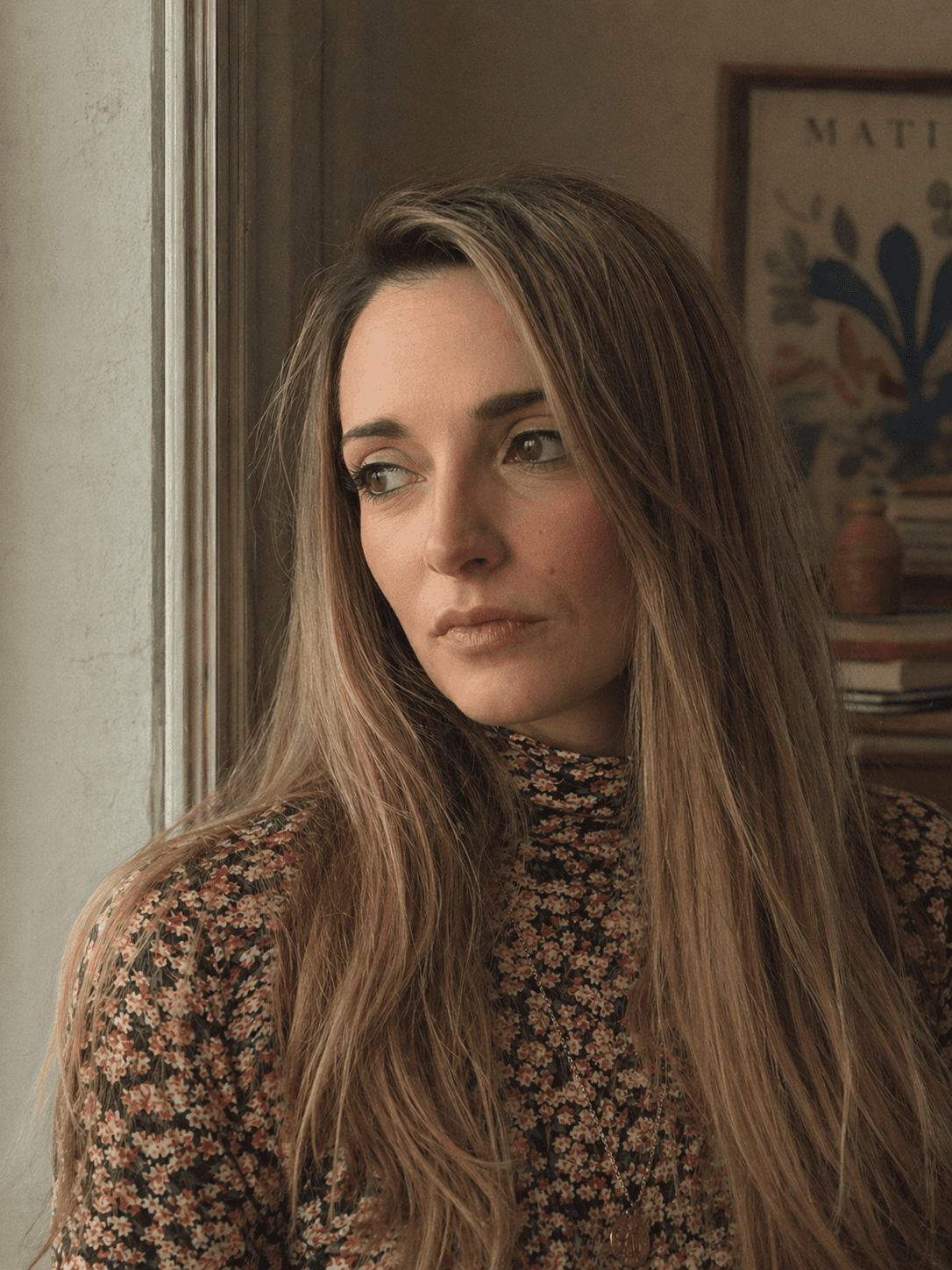 Elisa Pretty — Australian perinatal counsellor, at home looking out the window